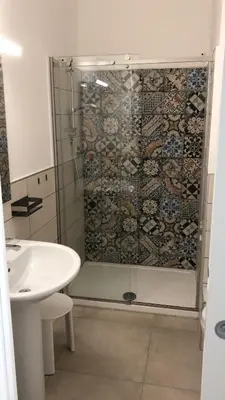 a bathroom with a shower and a sink at B&B Bellavista in Palermo