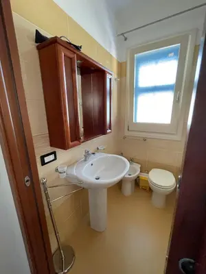 a bathroom with a sink and a toilet at NEREA - Appartamento fronte mare in San Vito lo Capo