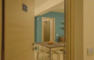 a small dining room with a table and chairs at Cozy Apartment In Balestrate With Wifi in Balestrate
