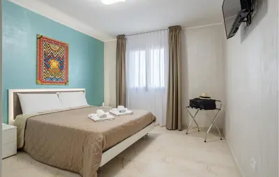 a bedroom with a bed with two towels on it at Cozy Apartment In Balestrate With Wifi in Balestrate