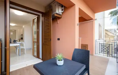 a small table with a potted plant on it in a room at Beautiful Apartment In Balestrate in Balestrate