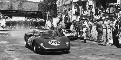 an old picture of a racing car in a race at Patio1861 - A Sicilian deluxe apartment in Termini Imerese