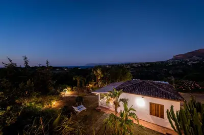 an aerial view of a house at night at NUOVA Villa Intera Guidaloca in Scopello