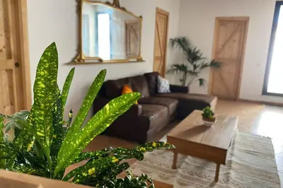 a living room with a couch and a table at Casaescape City in Palermo