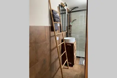 a ladder in a bathroom with a shower at Casaescape City in Palermo