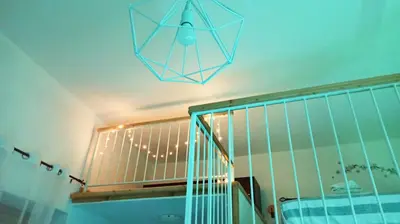 a pendant light hanging from a ceiling above a staircase at Le notti di Nettuno a Isola Delle Femmine in Isola delle Femmine