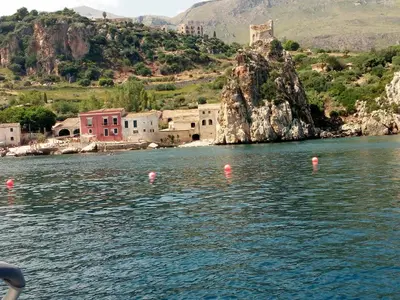 a body of water with pink buoys in the water at Residenza sabbia dorata in Alcamo