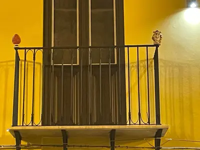 a black railing on top of a balcony at Case vacanze donna Ina in Palermo