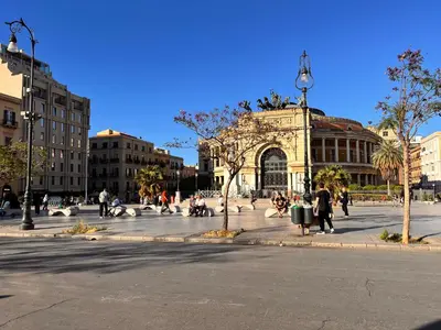 a group of people walking around a plaza in a city at Donizetti 19 in Palermo