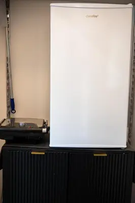 a large white screen on top of a black cabinet at Le Tartarughe di Ro' Casavacanze in Mondello