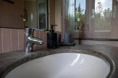 a bathroom sink with a faucet on a counter at Le Tartarughe di Ro' Casavacanze in Mondello