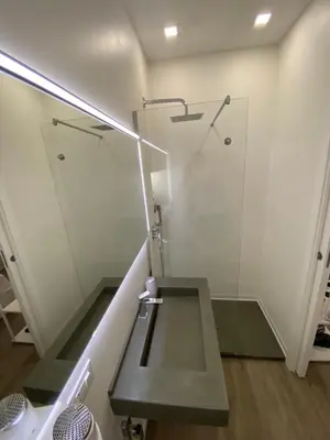 a bathroom with a sink and a glass shower at SuiteInPalermo - case vacanze nel centro storico in Palermo
