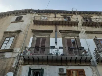 an old building with windows and balconies on it at CASA DEI SOGNI in Palermo