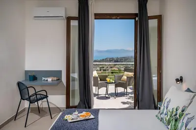a bedroom with a bed and a view of a balcony at Villa Maria con piscina e vista mare in Castellammare del Golfo
