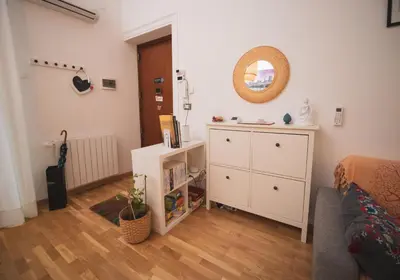 a bedroom with a bed and a dresser and a mirror at Itiseasy Palermo 1 e 2 Private Apartments in Palermo