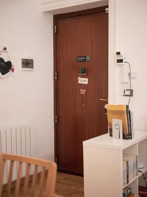 a door in a room with a wooden door at Itiseasy Palermo 1 e 2 Private Apartments in Palermo