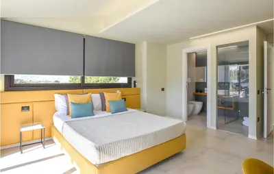 a bedroom with a bed and a large window at 5 Bedroom Nice Home In Trappeto in Trappeto