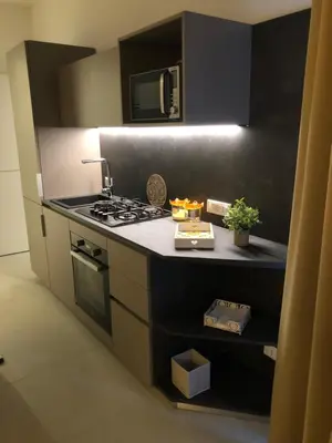 a kitchen with a stove and a counter top at Porta del Golfo Apartments & Suites in Castellammare del Golfo