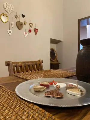 a plate with sandwiches and hearts on a table at Casa Vetriera in Palermo