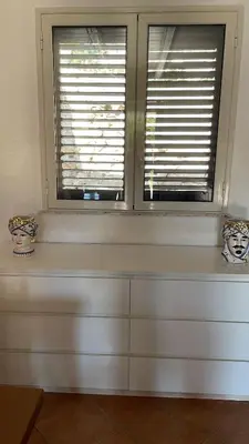 two vases sitting on a window sill in a room at Campofelice Casa vacanza in Palermo