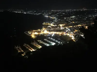 an aerial view of a city at night at Casa Bouganville in Scopello