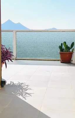 a balcony with a view of the ocean at Sostegno d'amore in Palermo