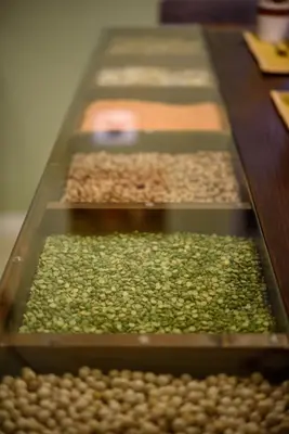a row of different types of nuts on a table at CELSO 14 in Palermo