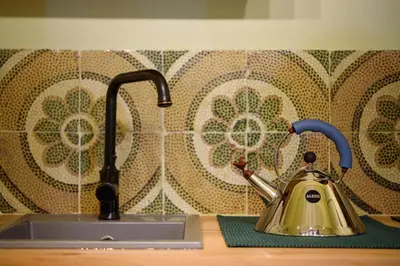 a tea kettle on a counter next to a sink at CELSO 14 in Palermo