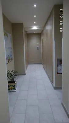 a hallway of an office building with a tile floor at Balsamotto - Appartamento e parcheggio in Palermo