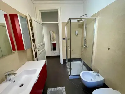 a bathroom with a shower and a sink and a toilet at Essenze di Sicilia Appartamento Cavour in centro in Palermo