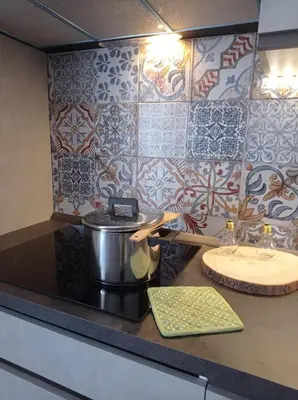 a kitchen counter with a pot and a sink at Essenze di Sicilia Appartamento Cavour in centro in Palermo