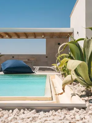 a swimming pool in front of a house at VILLA DELLA QUBBAH with pool in Alcamo