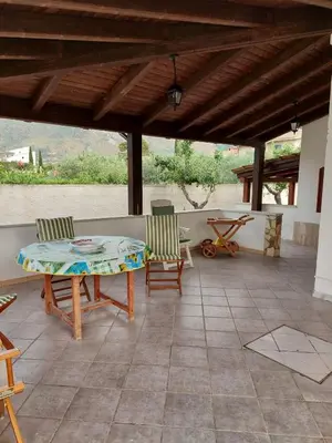 a patio with a table and chairs on a patio at Villa Maricetta in Castellammare del Golfo