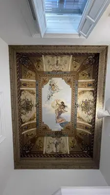 a ceiling in a room with a painting on it at DonnaFrancaFlorio in Palermo