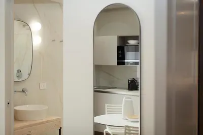 a bathroom with a sink and a mirror at NITI Palace in Castellammare del Golfo
