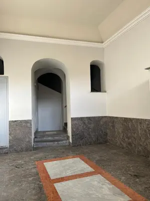 an empty room with a white wall and an entry way at Casa Kilò in Palermo