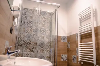 a bathroom with a shower and a sink at Casa Vespucci in Isola delle Femmine