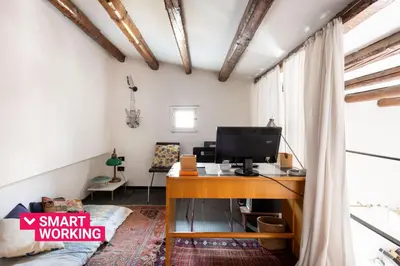 a room with a desk with a computer on it at Iconic Apartment in Porta Carini by Wonderful Italy in Palermo