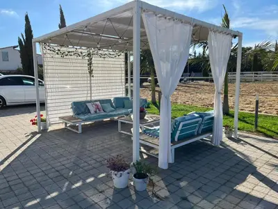 a gazebo with a bench and a canopy at Casa RALIVO di Sicilia in Balestrate