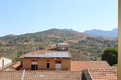a house with a group of solar panels on the roof at Bianca Casa in Bolognetta