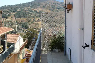a view from the balcony of a house with a plant at Bianca Casa in Bolognetta