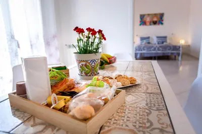 a table with a box of food on it at Bianca Casa in Bolognetta