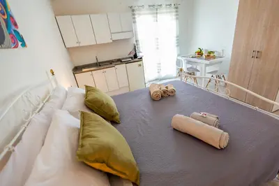 a bed with pillows and towels on it in a room at Bianca Casa in Bolognetta
