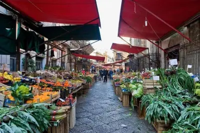 an outdoor market with fruits and vegetables on display at Dimora al Capo in Palermo
