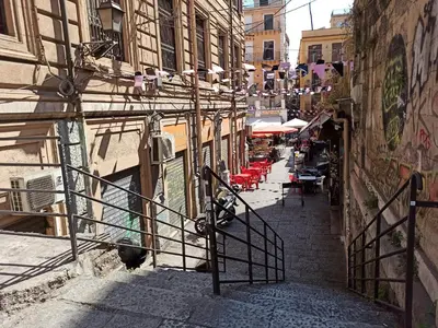 a sign on the side of a street at 'A CASETTA RA ZIA PAOLA in Palermo