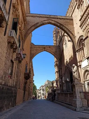 an empty street in a city with buildings at 'A CASETTA RA ZIA PAOLA in Palermo