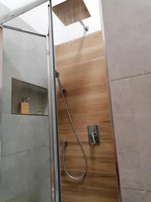 a shower with a hose in a bathroom at Nella House in Castellammare del Golfo