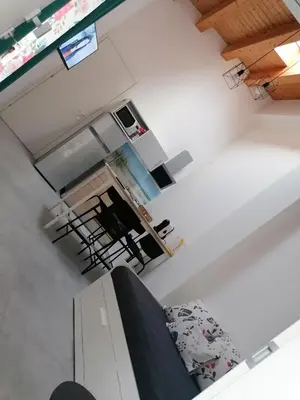 an overhead view of a living room and kitchen with a couch at Nella House in Castellammare del Golfo