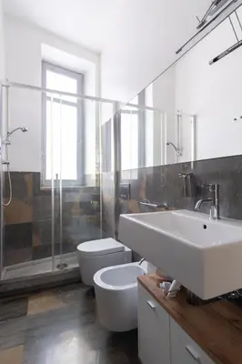 a bathroom with a sink and a toilet and a shower at Rome 118 in Palermo