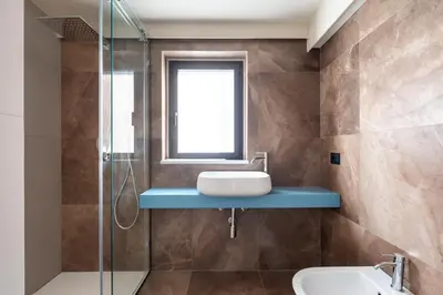 a bathroom with a sink and a shower at Villa vista mare con piscina a sfioro a Scopello in Castellammare del Golfo